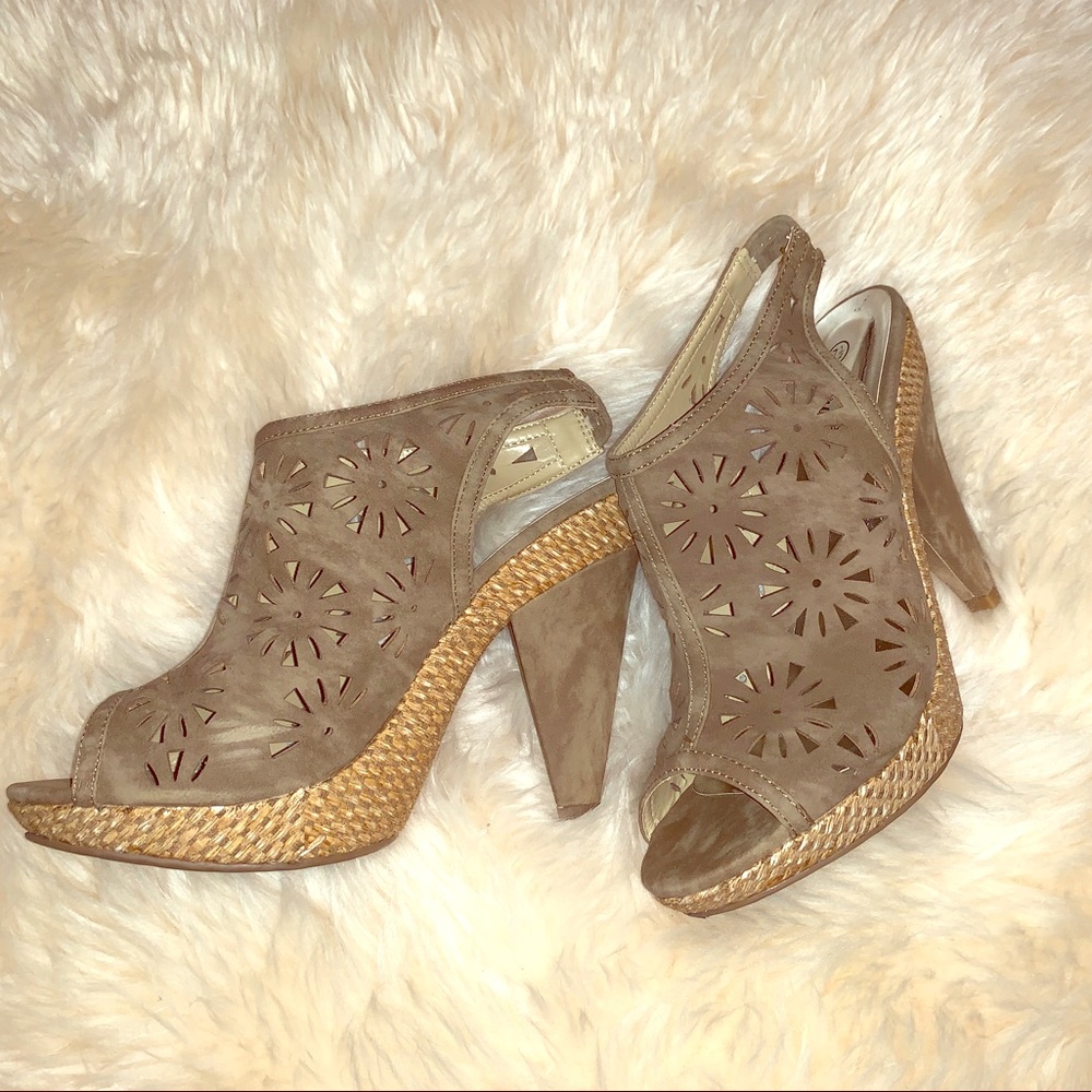 Suede open toe shoe with back adjustable strap.